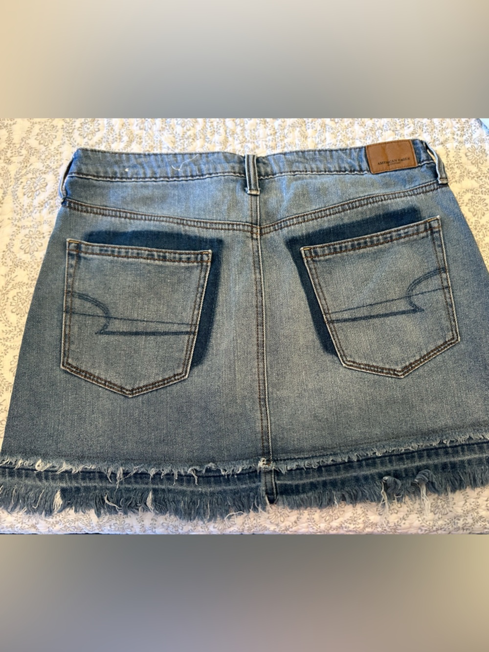 American Eagle Outfitters Light Blue Denim Mini Skirt with Frayed Hem